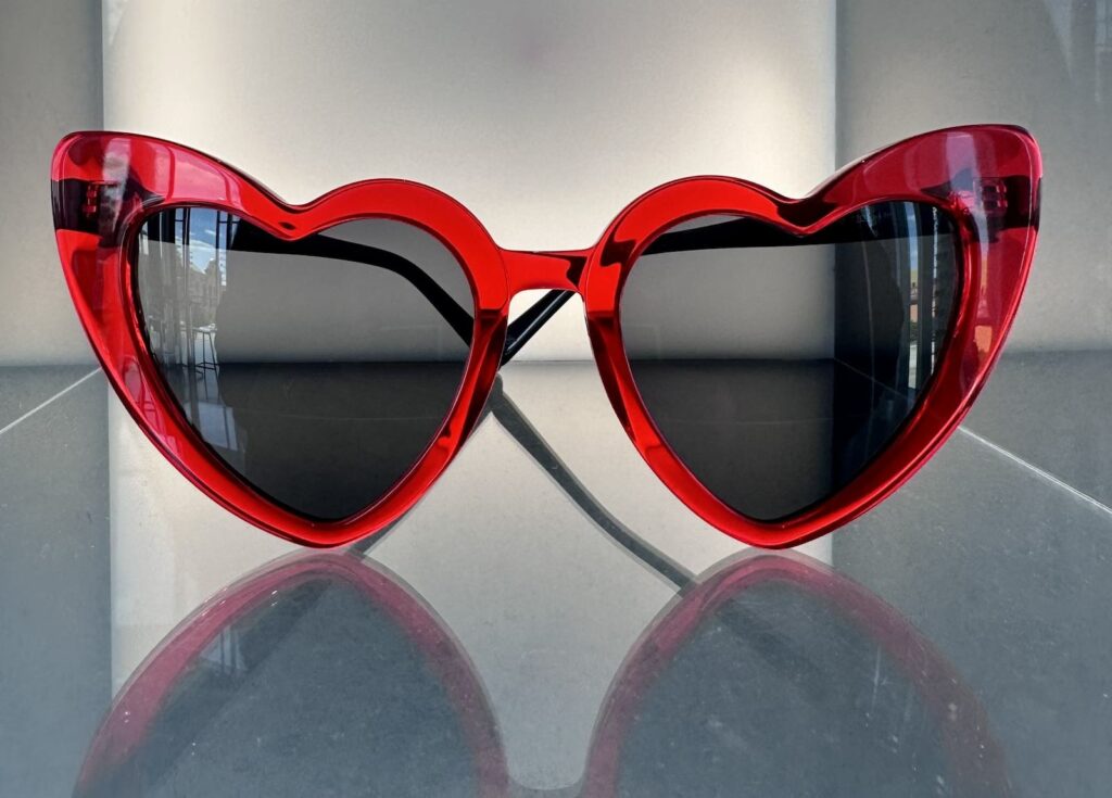 Photo of a red pair of heart shaped glasses by Catch London