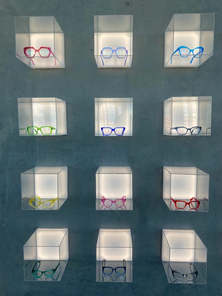 Acrylic glasses display cubes at CHROMA modern Eyewear Eyecare in Fort Worth, Texas.