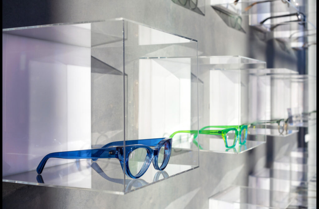 CHROMA modern Eyewear & Eyecare blue and green glasses.