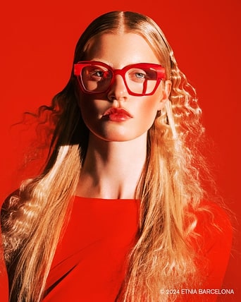 Woman facing the camera wearing bold red Etnia Barcelona CHROMA frames.