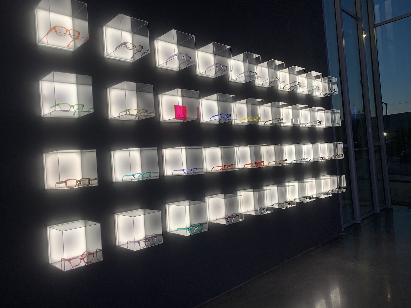 Block wall display for glasses at CHROMA modern in Fort Worth, Texas.