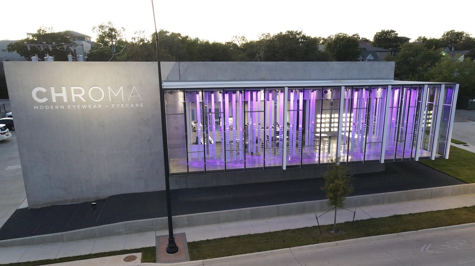 CHROMA front of building at dusk with optical displays lit