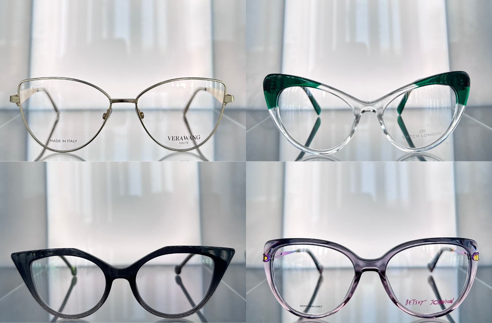 Four cat-eye eyeglass frames in gold, green, black, and purple styles displayed on a glass shelf.